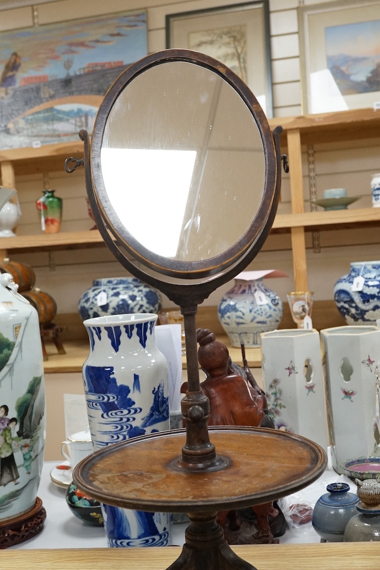 A Victorian mahogany gentleman's shaving mirror on stand with circular shelf, 65cm high.